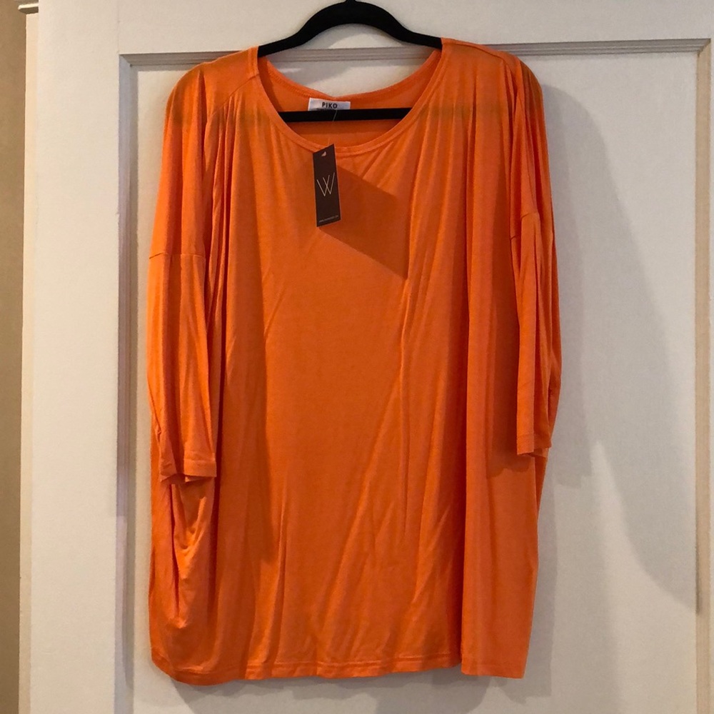 Piko orange top. Size M. NWT.